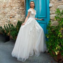 Fairy Lace Appliques Deep V-Neck Short Sleeves A-Line Bridal Gown 2022 Backless Glitter Tulle Train Sexy Vestido De Novia