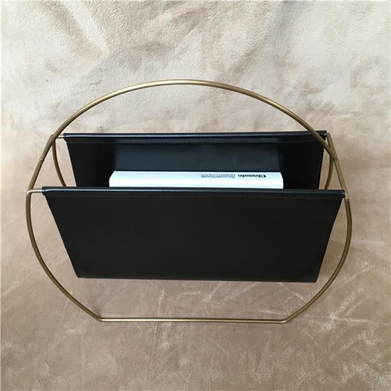 Leather metal magazine rack with a small Folder grip on the desk of a stainless steel shelf at home a newspaper rack